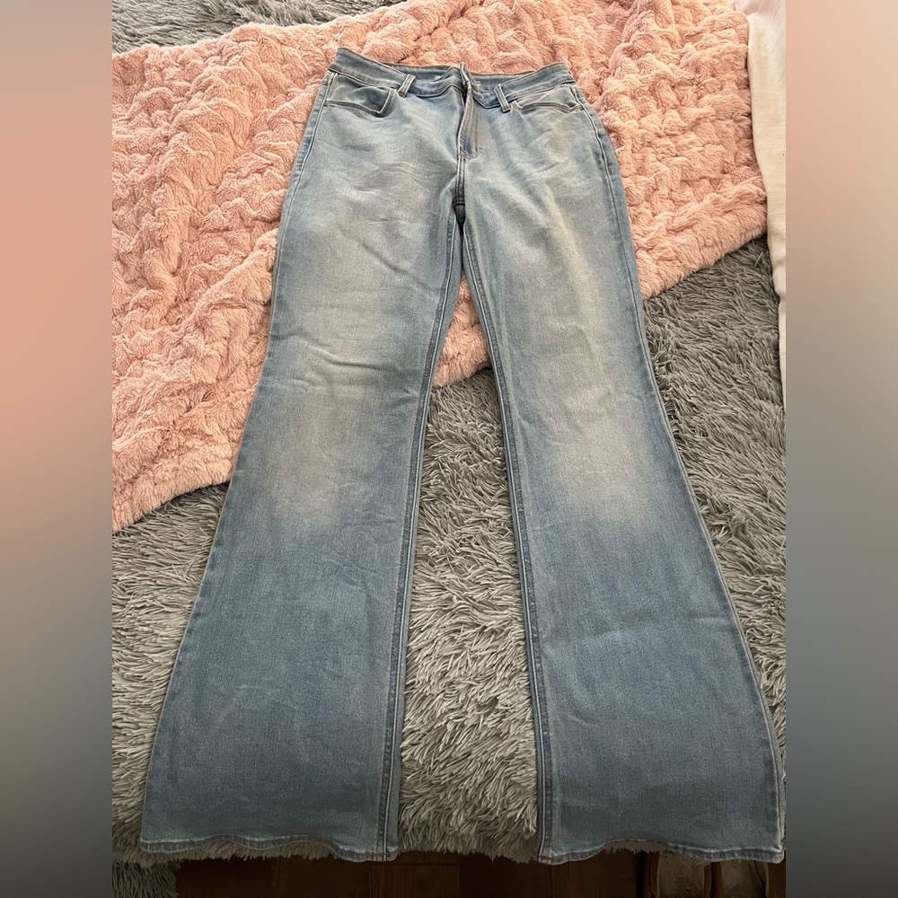 High waisted flared light wash jeans.